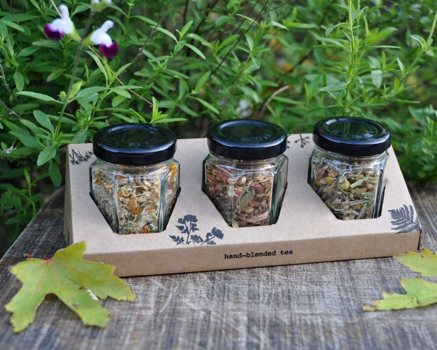 Branded gift box containing 3 glass jars with herbal tea