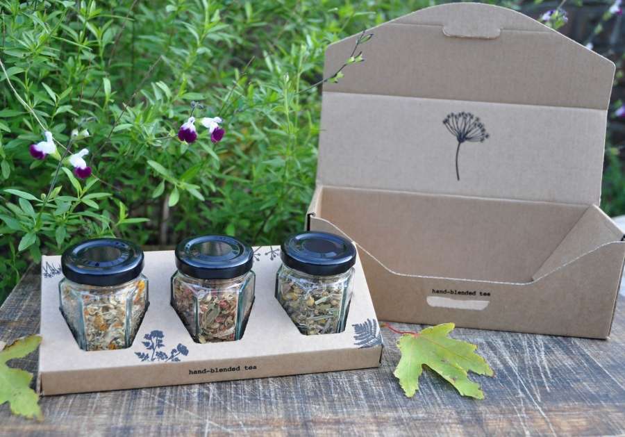 Branded gift box containing 3 glass jars with herbal tea